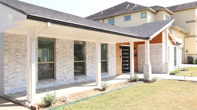 rear view of house featuring a lawn