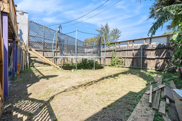 view of yard featuring a trampoline