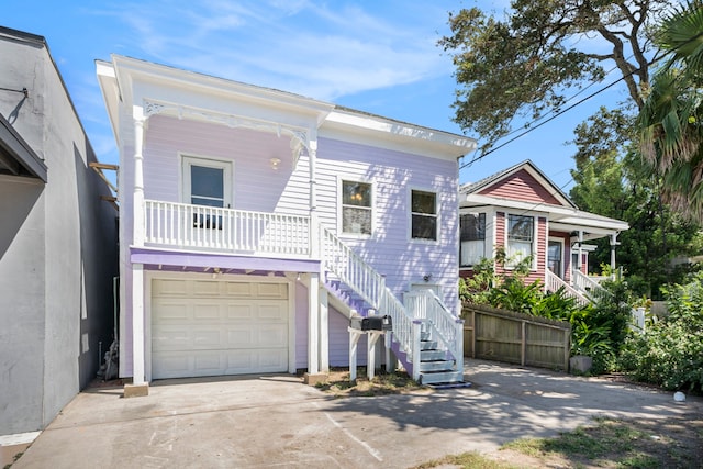 view of front facade with a garage and a porch