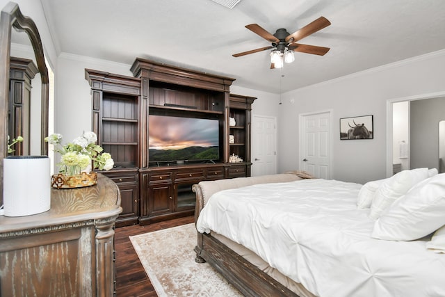 bedroom with ornamental molding, ceiling fan, and dark wood-type flooring