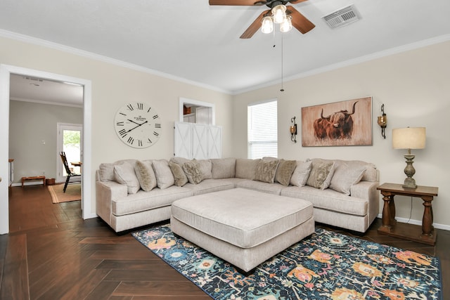 living room featuring dark parquet flooring, crown molding, and ceiling fan