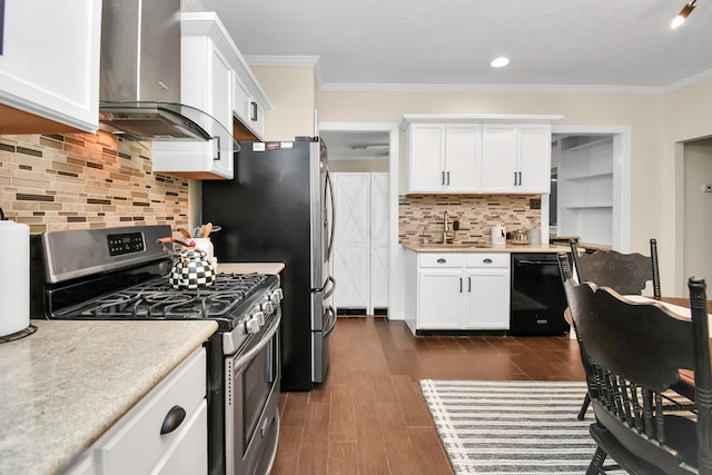 kitchen with wall chimney range hood, tasteful backsplash, dark hardwood / wood-style floors, white cabinets, and appliances with stainless steel finishes