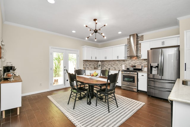 dining space featuring crown molding, dark hardwood / wood-style flooring, french doors, and an inviting chandelier