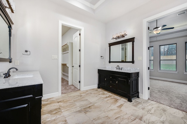 bathroom with ceiling fan and vanity