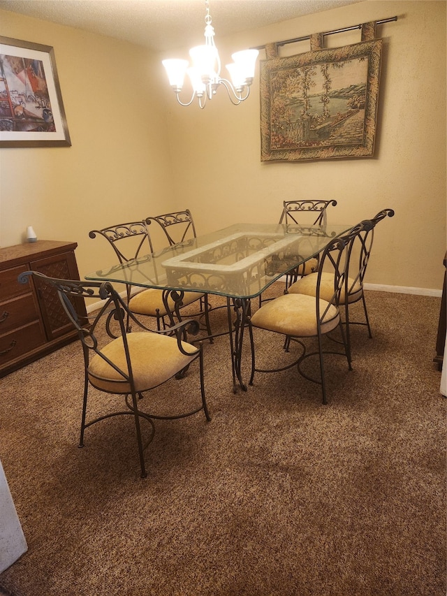 dining space with dark carpet, a textured ceiling, and an inviting chandelier