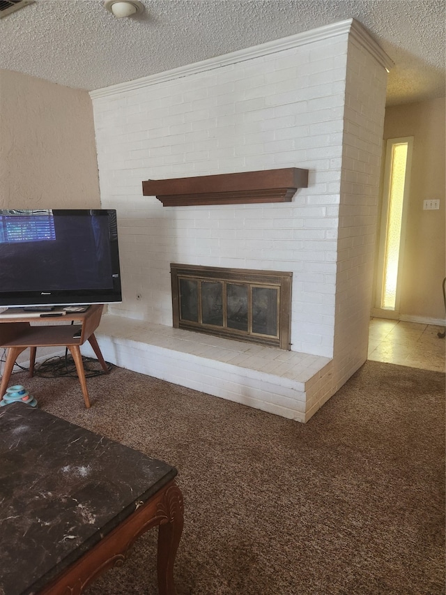 carpeted living room with a fireplace and a textured ceiling