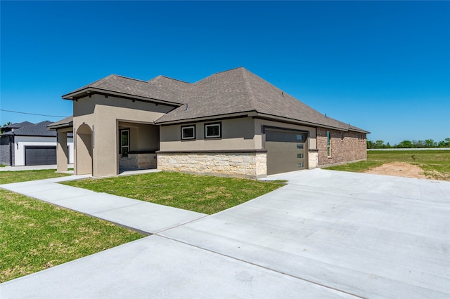 view of front facade with a front lawn and a garage