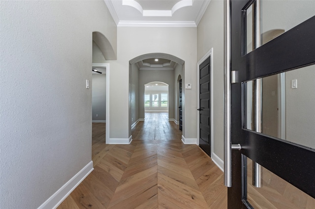 corridor featuring ornamental molding and parquet flooring