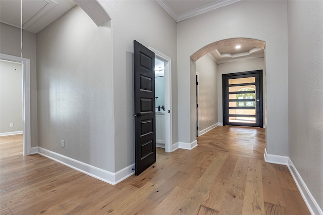 hall featuring light hardwood / wood-style flooring and crown molding