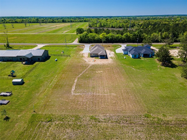 birds eye view of property with a rural view