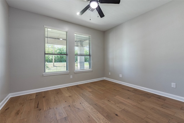 empty room with light wood-type flooring and ceiling fan