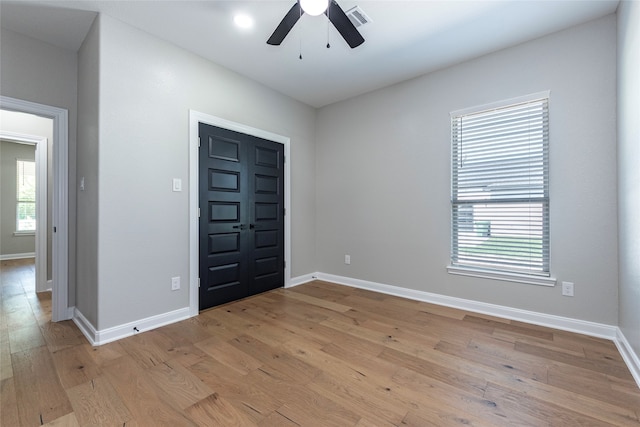 interior space with light hardwood / wood-style floors and ceiling fan