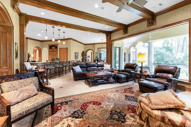 tiled living room featuring crown molding, ceiling fan, and beamed ceiling