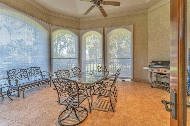 dining area featuring ceiling fan and crown molding