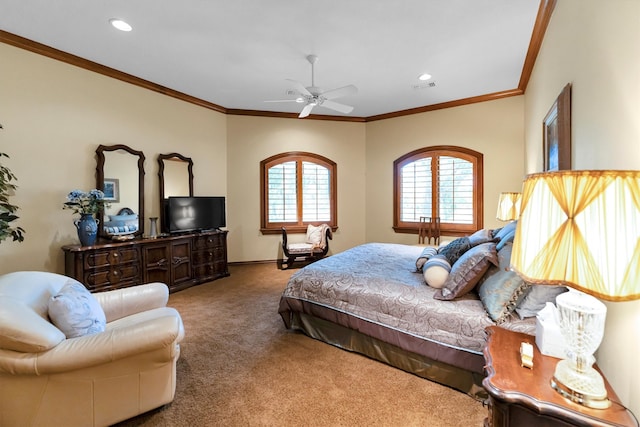 carpeted bedroom featuring crown molding and ceiling fan