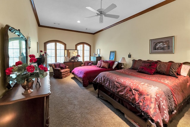 bedroom with ceiling fan, crown molding, and carpet