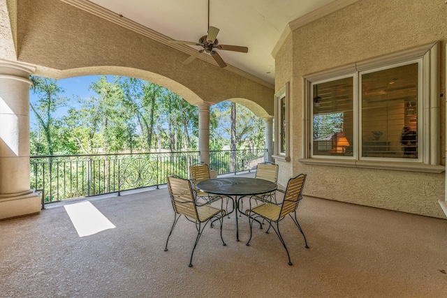 view of patio featuring a balcony and ceiling fan