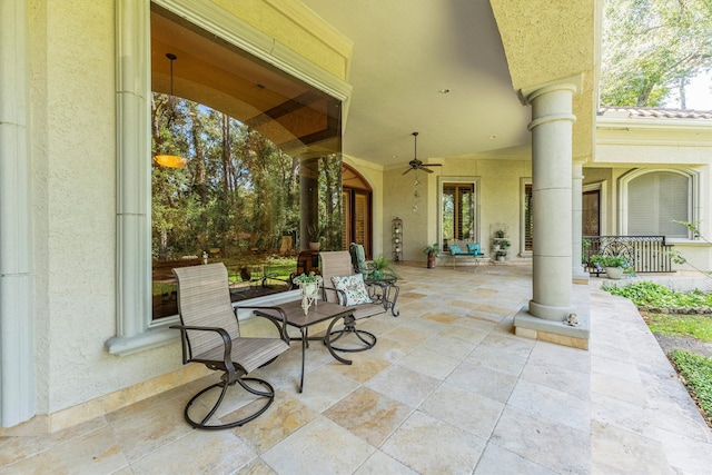 view of patio featuring ceiling fan