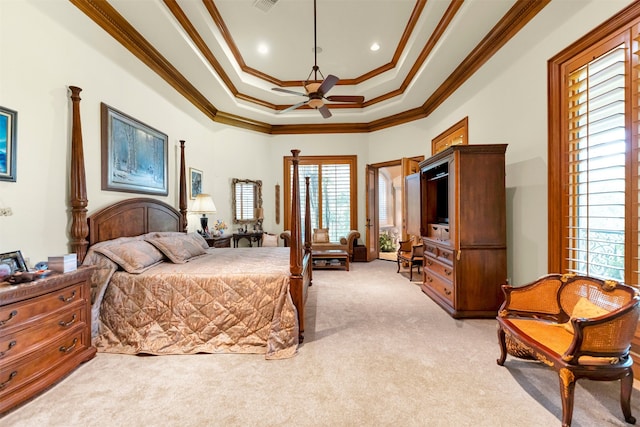 bedroom featuring light carpet, a raised ceiling, ornamental molding, and multiple windows