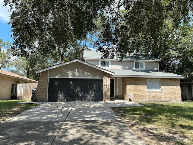 front of property with a garage and a front yard