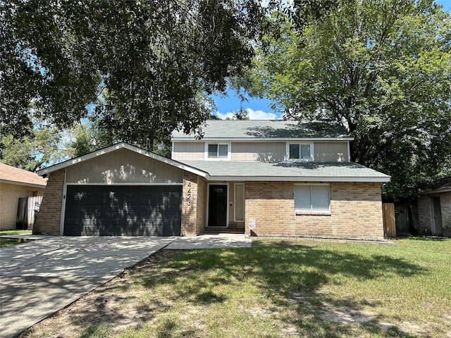 view of front property with a garage and a front lawn