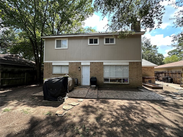 back of property featuring a patio