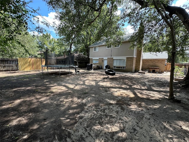 view of yard with a trampoline