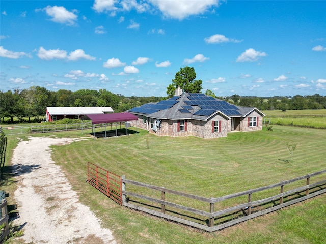 exterior space with a rural view and a carport