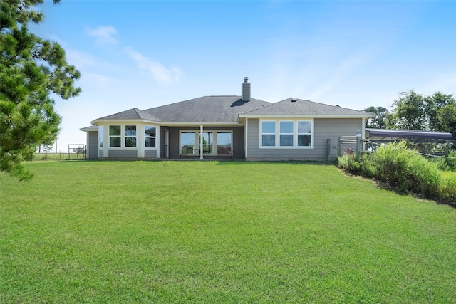 back of house featuring a yard