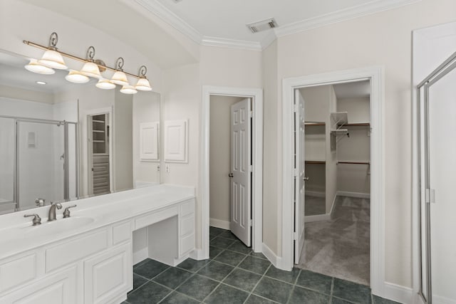 bathroom with ornamental molding, vanity, tile patterned flooring, and an enclosed shower