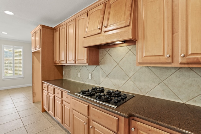 kitchen with decorative backsplash, black gas cooktop, light tile patterned floors, and ornamental molding