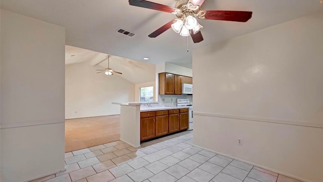 kitchen with ceiling fan, vaulted ceiling with beams, kitchen peninsula, white appliances, and light colored carpet