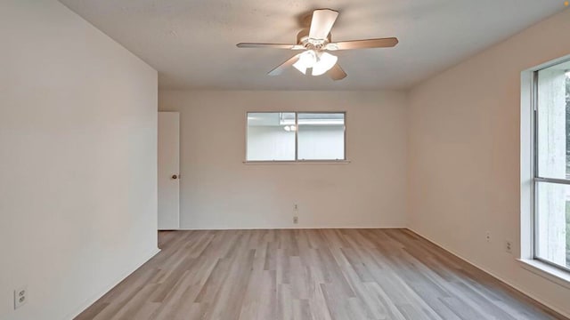 unfurnished room featuring light hardwood / wood-style flooring and ceiling fan