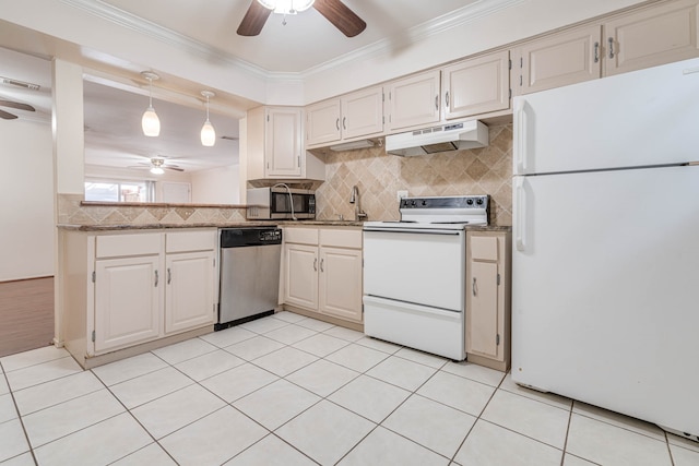 kitchen featuring appliances with stainless steel finishes, tasteful backsplash, light tile patterned floors, ceiling fan, and ornamental molding