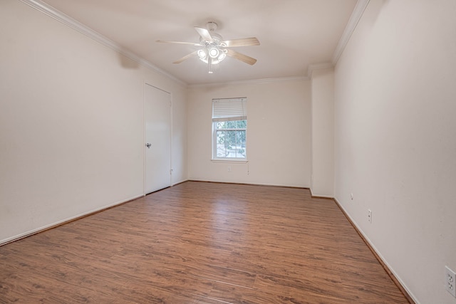 spare room with ceiling fan, crown molding, and hardwood / wood-style floors