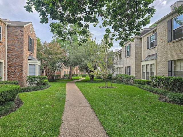 view of community with a lawn