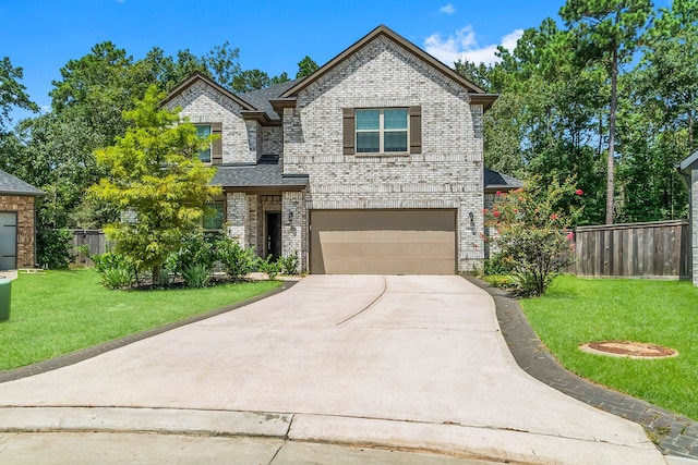 view of front of home featuring a front yard and a garage