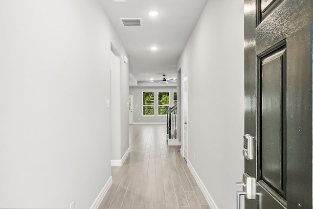 hallway featuring hardwood / wood-style flooring