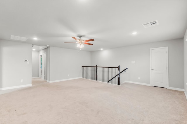 carpeted empty room featuring ceiling fan