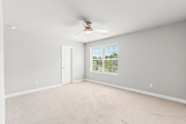 carpeted empty room with ceiling fan