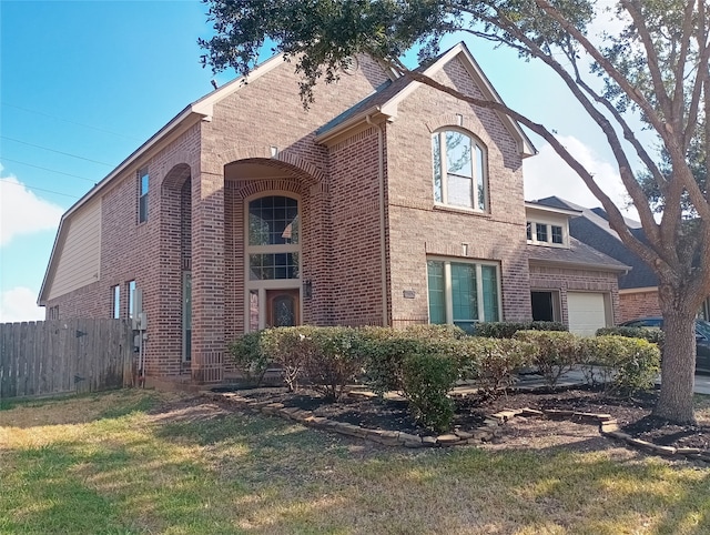 view of front of property featuring a garage and a front yard