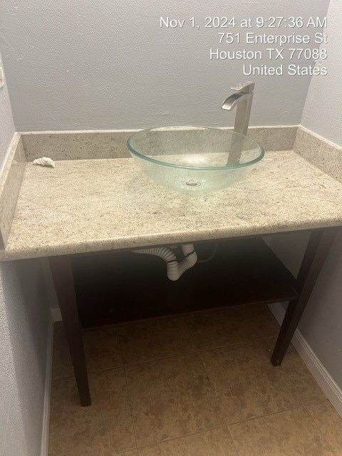 bathroom featuring sink and tile patterned flooring