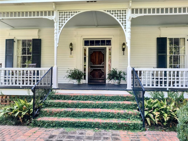 doorway to property with covered porch