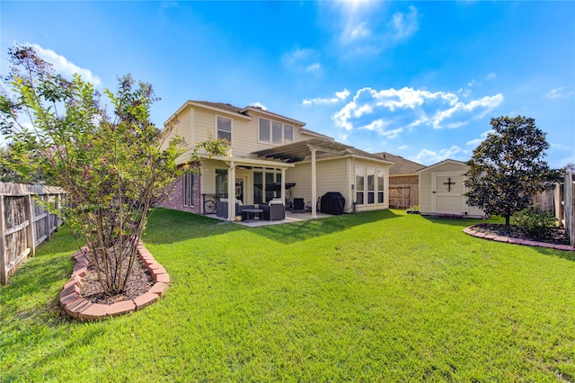 rear view of property with a patio, ceiling fan, and a yard