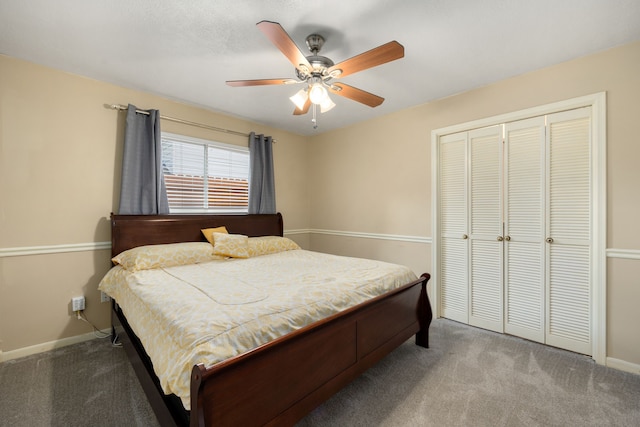 carpeted bedroom featuring ceiling fan and a closet