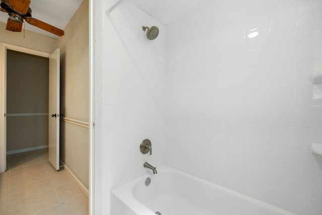 bathroom with ceiling fan, tiled shower / bath, and tile patterned flooring