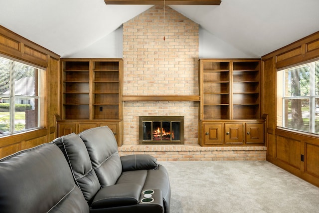 living room featuring light colored carpet, a fireplace, wood walls, and lofted ceiling