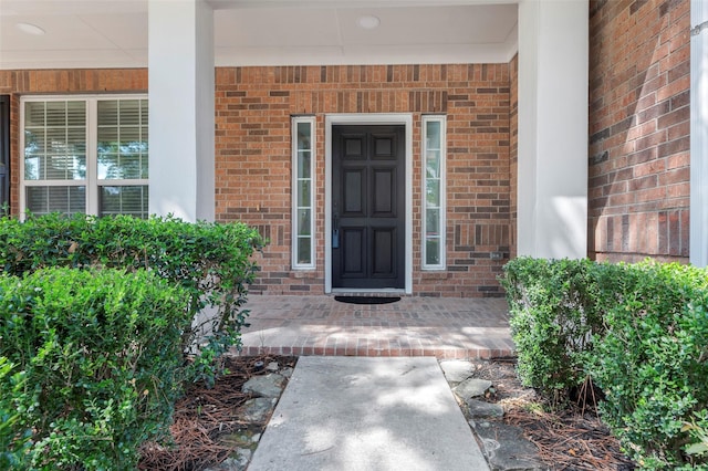 doorway to property featuring covered porch