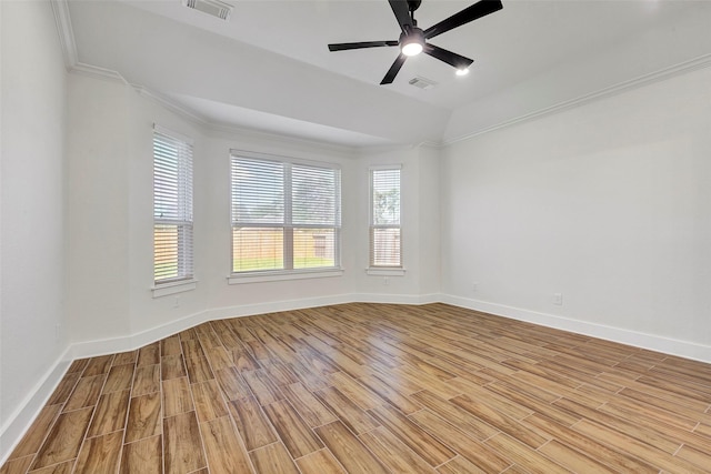 spare room with ceiling fan, ornamental molding, and light hardwood / wood-style flooring