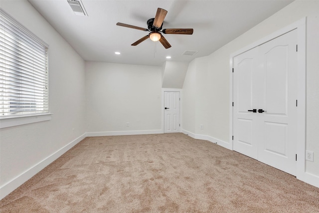 carpeted empty room with ceiling fan